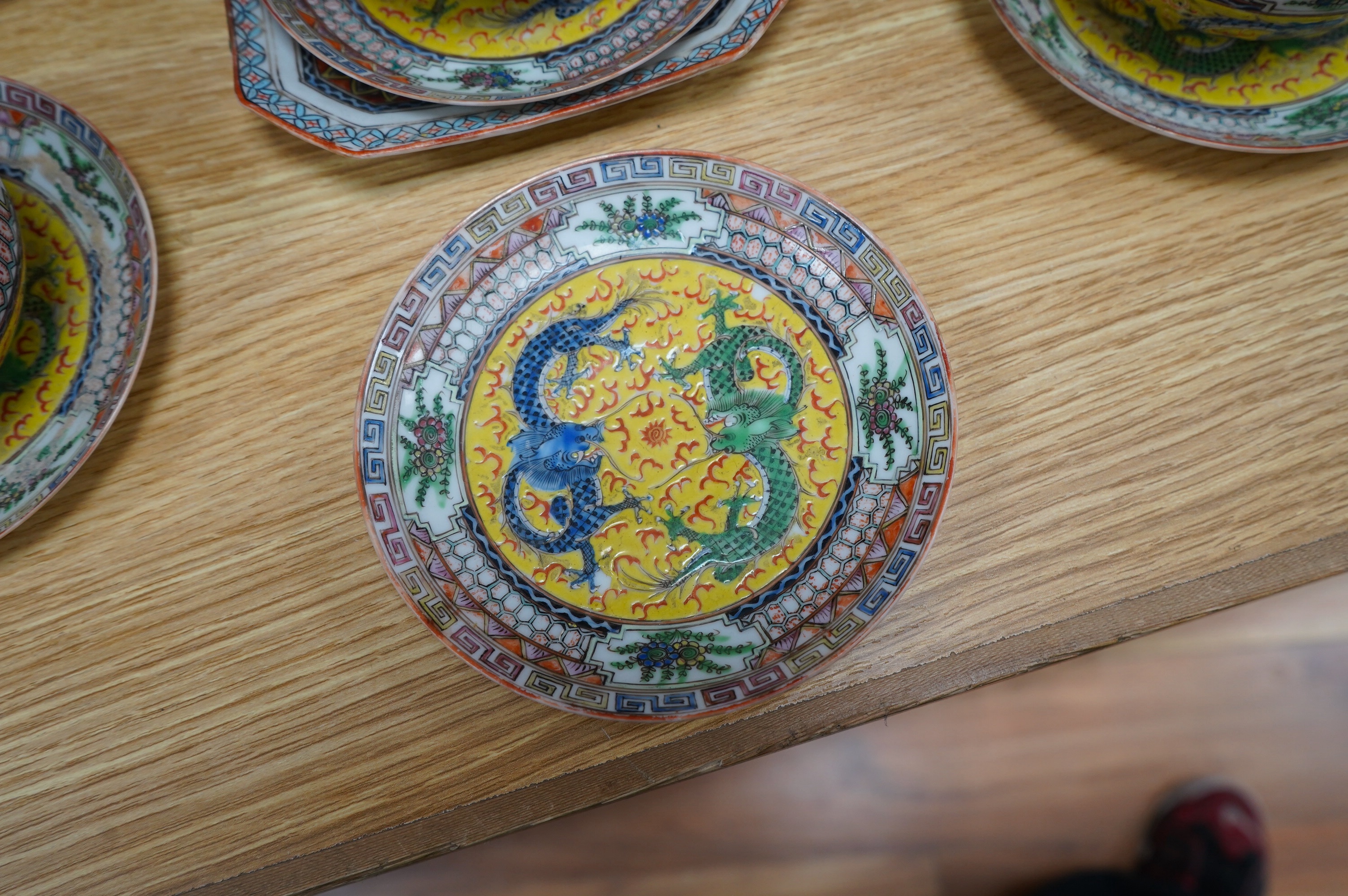 An early 20th century Chinese eggshell porcelain part tea set, with a yellow ground and coloured dragons (22). Condition - cups have slight chipping to top edges